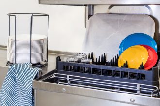 Black Dishwasher Rack in use with plates and trays